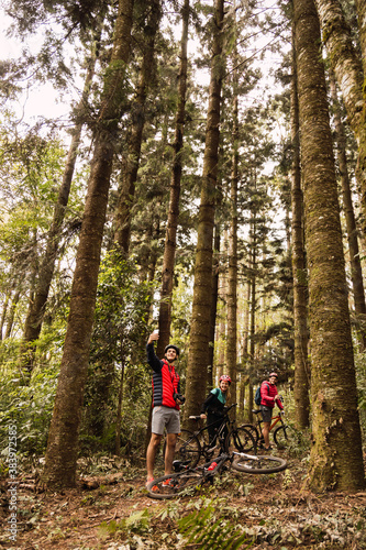 Cycling friends take a picture. Rest in the tropical forest of Misiones. Outdoor and sport concept.