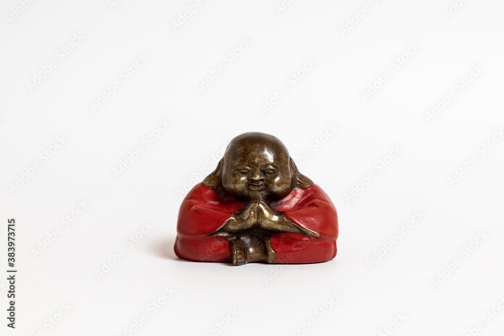 Fat Buddha dressed in red on a white background Chinese Buddha.