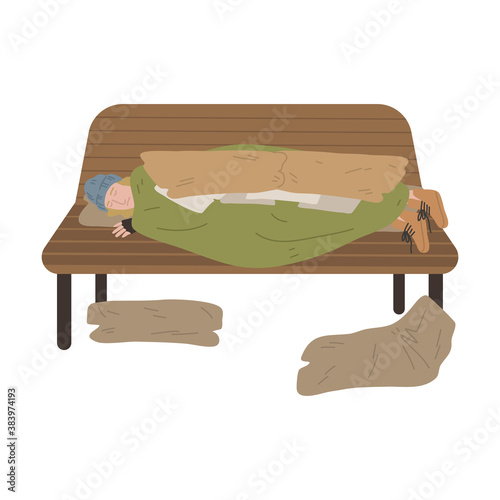 Homeless man sleeping on bench under old blanket outdoors