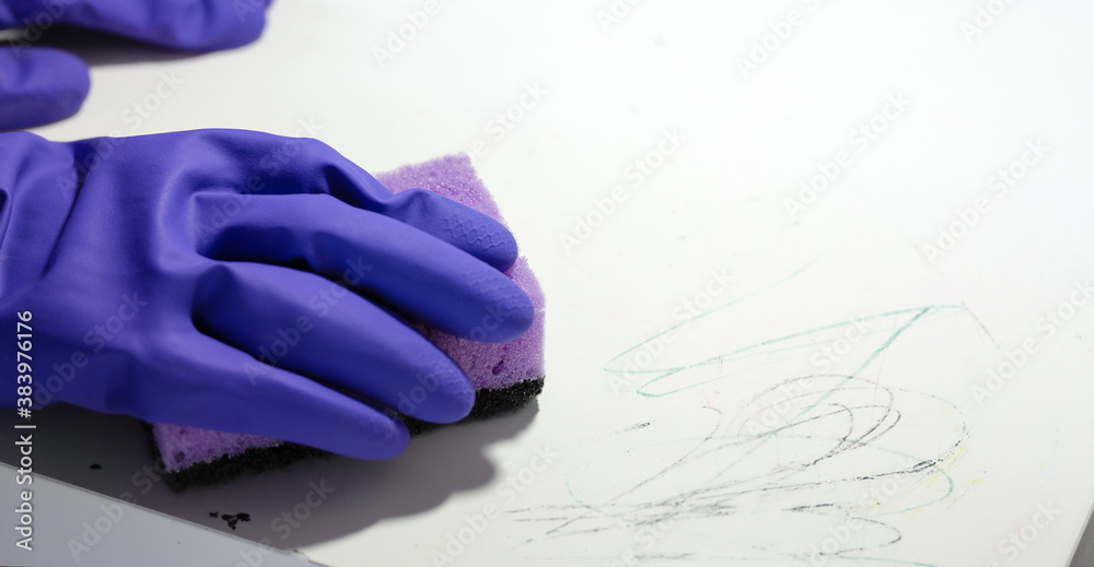 Banner with hands holding sponge and cleaning painted surface of table Banner with hands holding sponge and cleaning painted surface of table