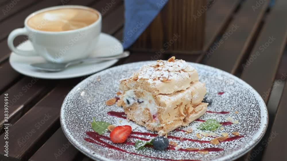 Delicious dessert on plate in outdoors cafe Delicious dessert on plate in outdoors cafe