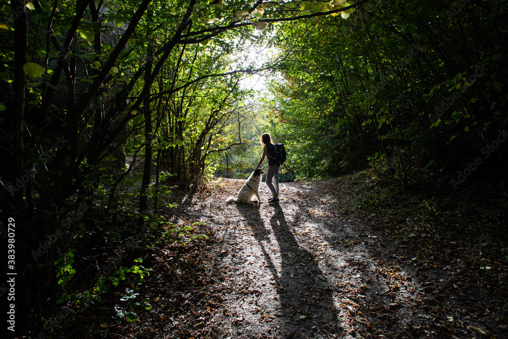 woman and dog enjoying the outdoors social distancing