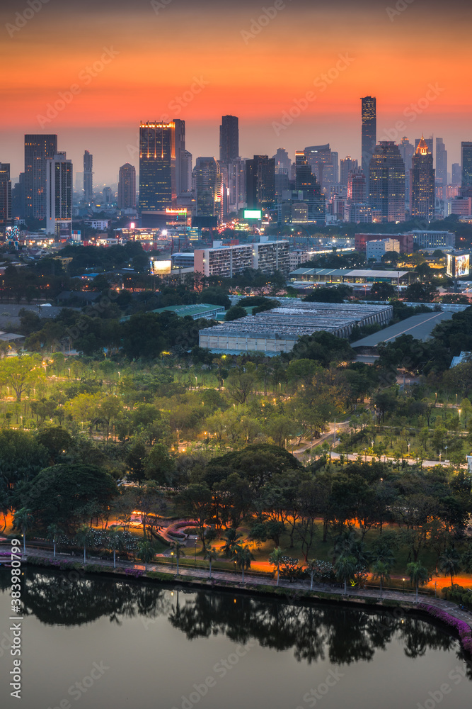 Bangkok, Thailand. Cityscape with Public Park and Skyscrapers at Twilight.