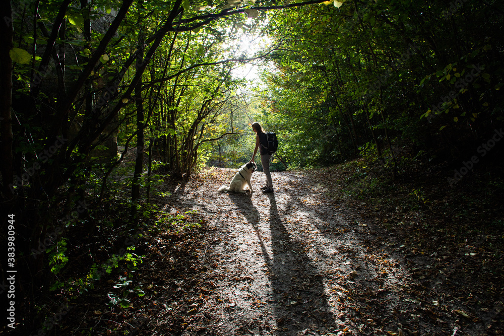 woman and dog enjoying the outdoors social distancing