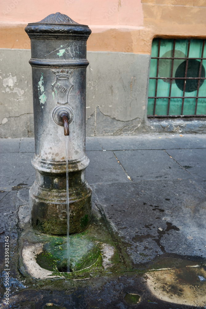 Sidewalk fountain on a street in Rome