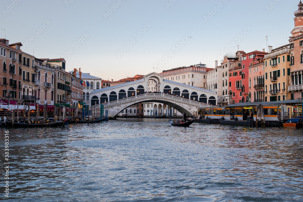 Heading towards the Rialto Bridge as the sun sets over the Grand Canal and Venice
