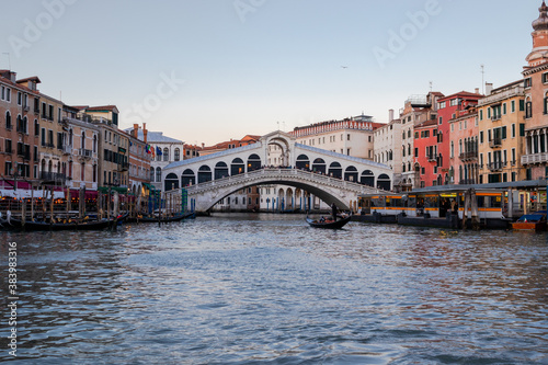 Heading towards the Rialto Bridge as the sun sets over the Grand Canal and Venice 