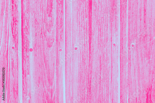 Pink background. Peeling paint on an old wooden background. Wood texture.