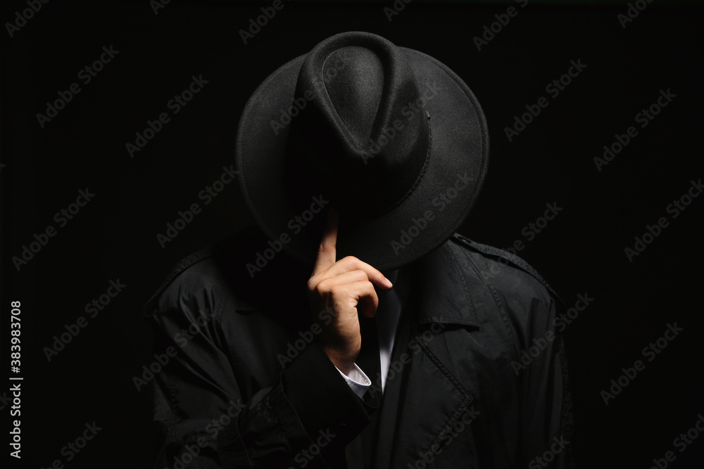 Old fashioned detective in hat on dark background - obrazy, fototapety, plakaty 