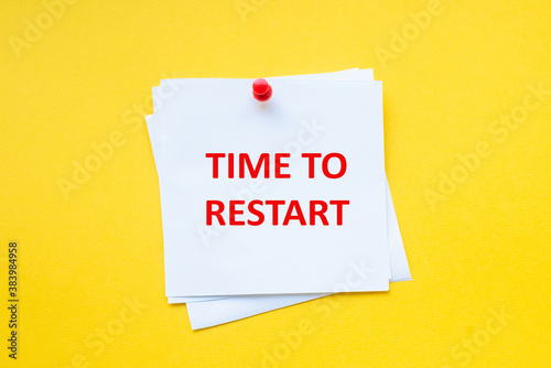 Time to restart. Motivational slogan on white sticker with yellow background