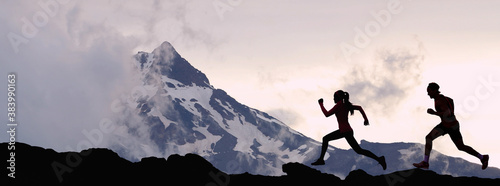 Panoramic banner of running people athletes sport fitness concept. Silhouette trail running in mountain summit background. Man and woman on run training outdoors active fit lifestyle. © Maridav