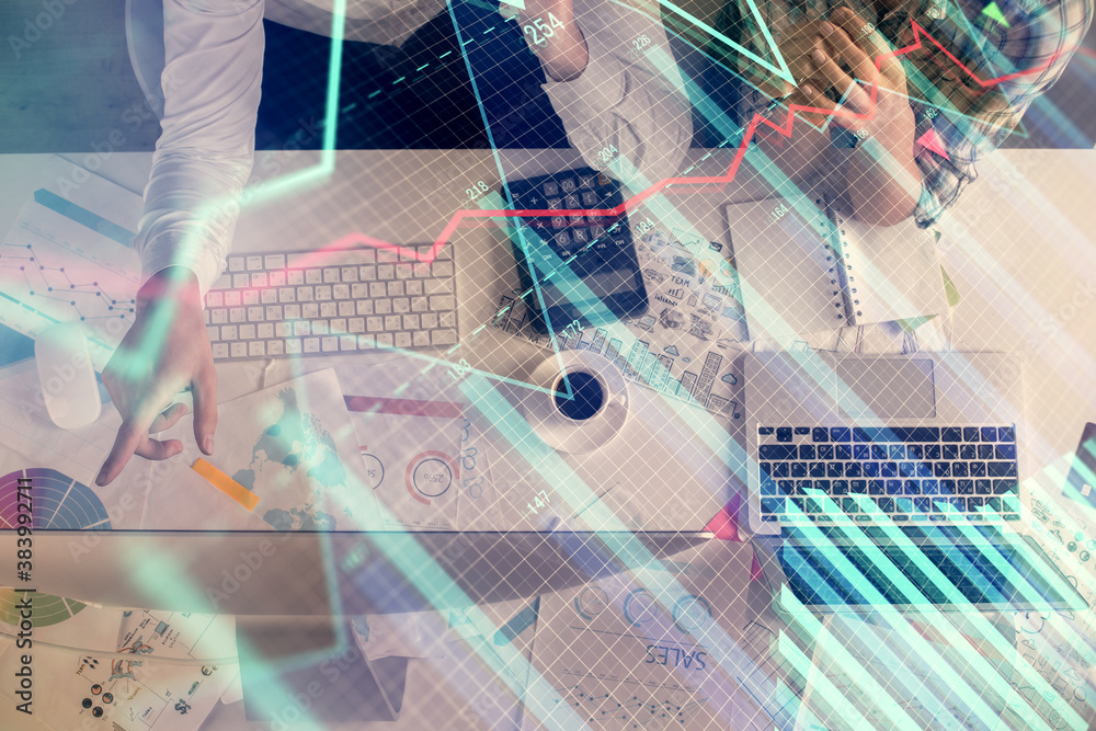 Double exposure of man and woman working together and financial chart hologram drawing. market analysis concept. Computer background. Top View. Double exposure of man and woman working together and financial chart hologram drawing. market analysis concept. Computer background. Top View.