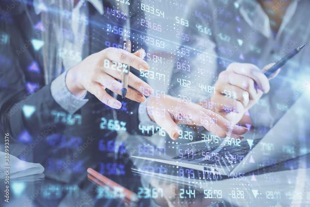 Multi exposure of man and woman working together and financial chart hologram. Business concept. Computer background. Multi exposure of man and woman working together and financial chart hologram. Business concept. Computer background.