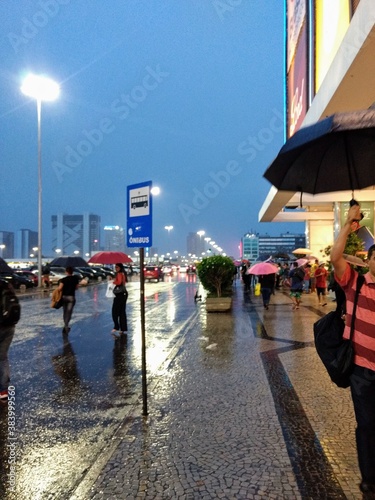 people walking on the rain