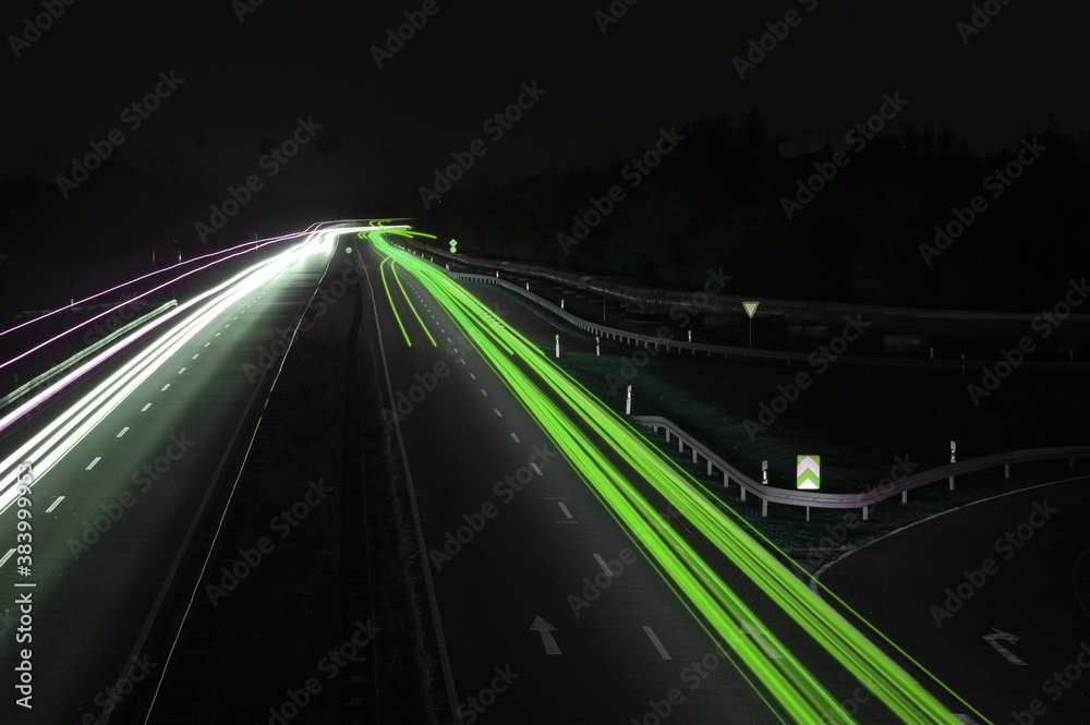 Obraz na plátně road with car traffic at night with blurry lights