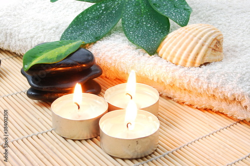 foldet white bath towel and zen stones photo