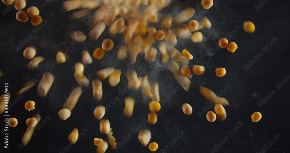 View from under the glass on falling dried peas, 4k View from under the glass on falling dried peas, 4k