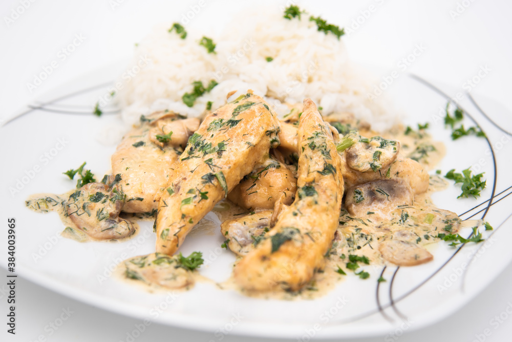 Creamy Herb Mushroom Chicken with steamed rice, dill and parsley closeup shot on a plate
Creamy Herb Mushroom Chicken with steamed rice, dill and parsley closeup shot on a plate