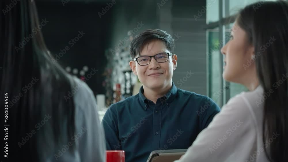 Happy Business man asian sitting in meeting with Team Business people to work happy with smile In modern office. New normal working agreement. Doctor Talking and consultation between people Happy Business man asian sitting in meeting with Team Business people to work happy with smile In modern office. New normal working agreement. Doctor Talking and consultation between people