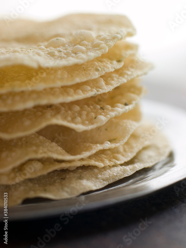 Stack of cooked Papadoms photo