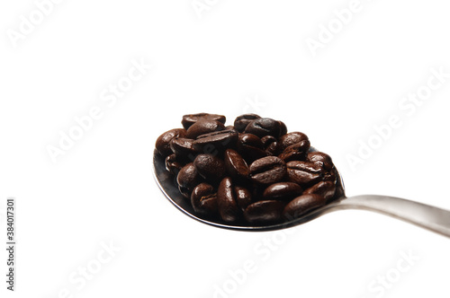 coffee beans on spoon photo