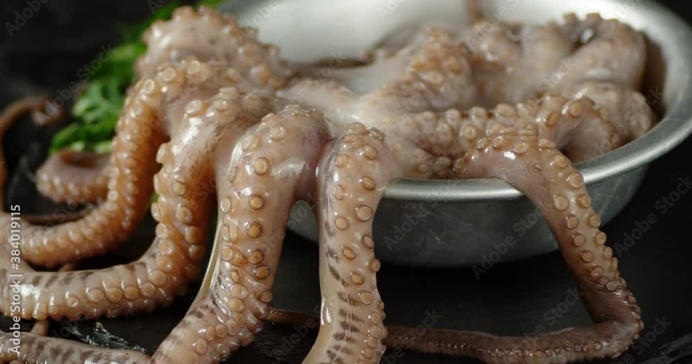 Bowl with raw octopus slowly rotates. Bowl with raw octopus slowly rotates.