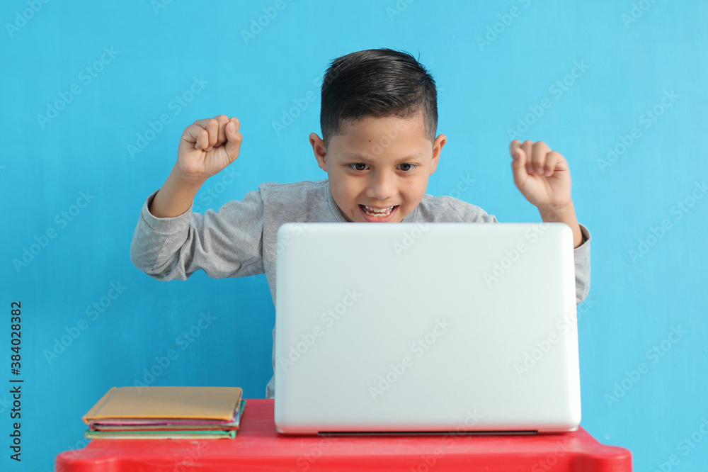 portrait of school boy with happy expression while studying. excited feeling portrait of school boy with happy expression while studying. excited feeling