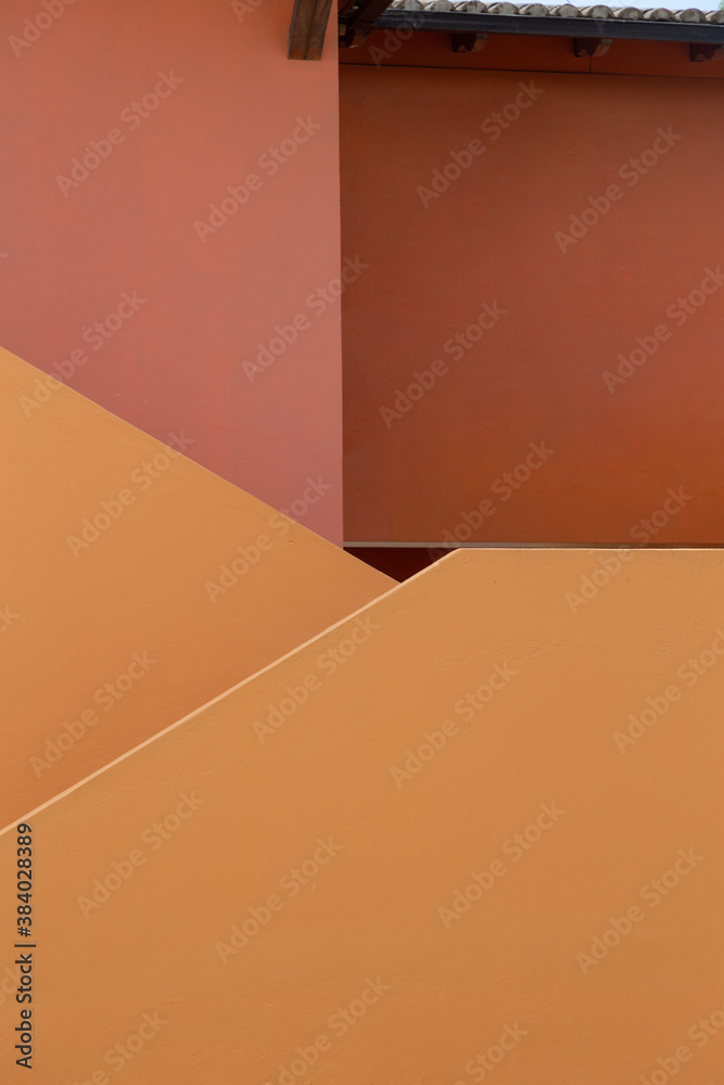 close-up to plain pink and orange wall, with straight lines, modern design close-up to plain pink and orange wall, with straight lines, modern design