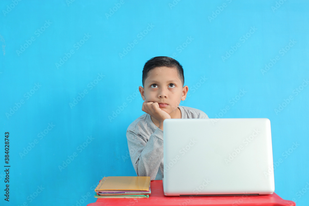 Tired little boy feel bored and sleepy while studying Tired little boy feel bored and sleepy while studying