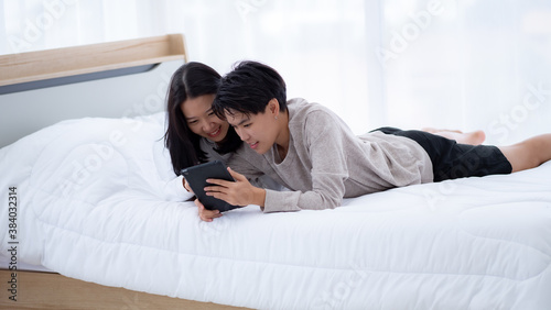 Homosexual relaxing on the bed