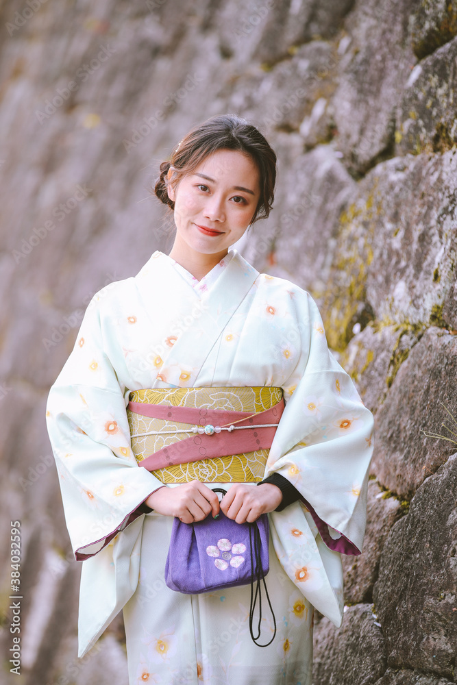 Girls Wearing Kimono with cherry blossoms in spring, Kyoto, Japan Girls Wearing Kimono with cherry blossoms in spring, Kyoto, Japan