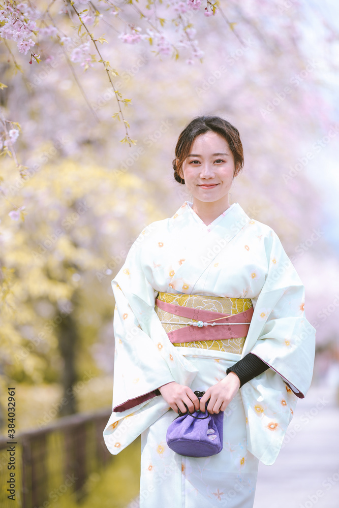 Girls Wearing Kimono with cherry blossoms in spring, Kyoto, Japan Girls Wearing Kimono with cherry blossoms in spring, Kyoto, Japan