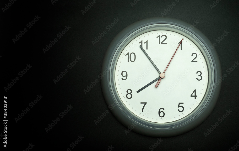 white clock Isolated showtime 07.54 o'clock on black background, Copy space for your text, Time concept. white clock Isolated showtime 07.54 o'clock on black background, Copy space for your text, Time concept.