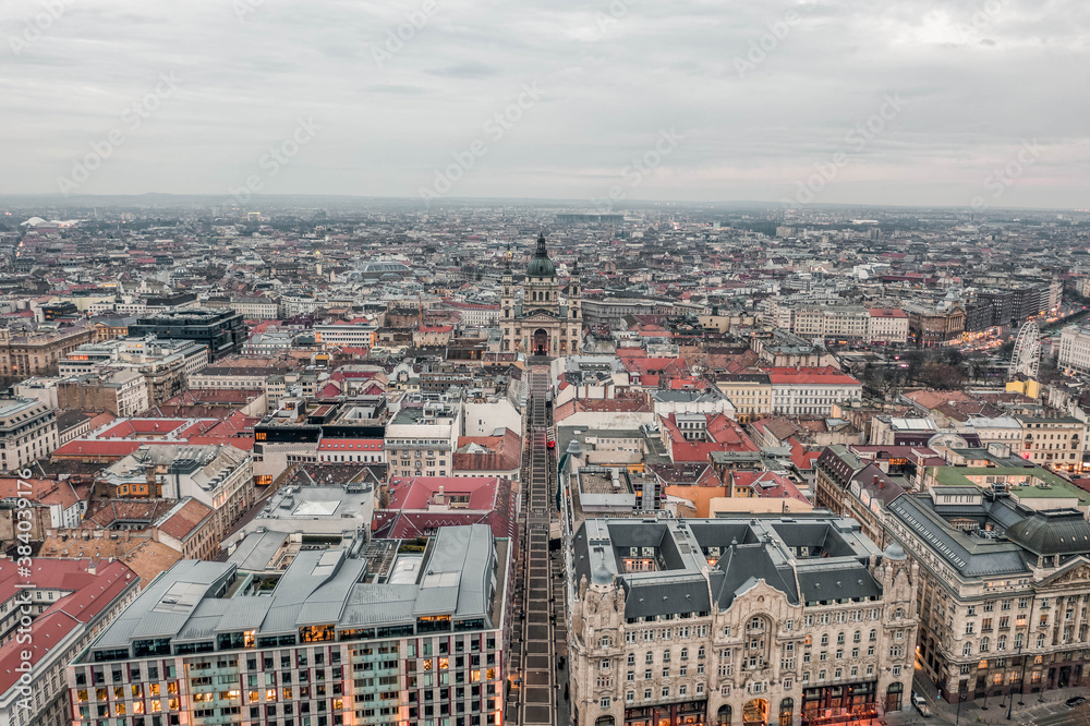Fototapeta premium Aerial drone shot of Zrinyi Street with view of St. Stephen's Basilica at dawn with city lights on