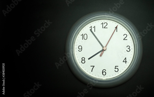 white clock Isolated showtime 07.54 o'clock on black background, Copy space for your text, Time concept.