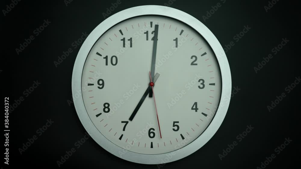 Minimal black clock isolated on black background. Minimal black clock isolated on black background.