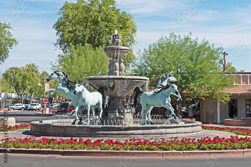 A bronze horse fountain situated in a central square in Old Town Scottsdale, Arizona. photo