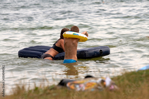 children on lake photo