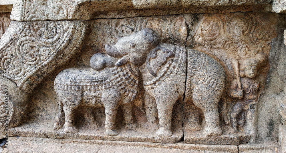 carving of a elephant and cow in the temple