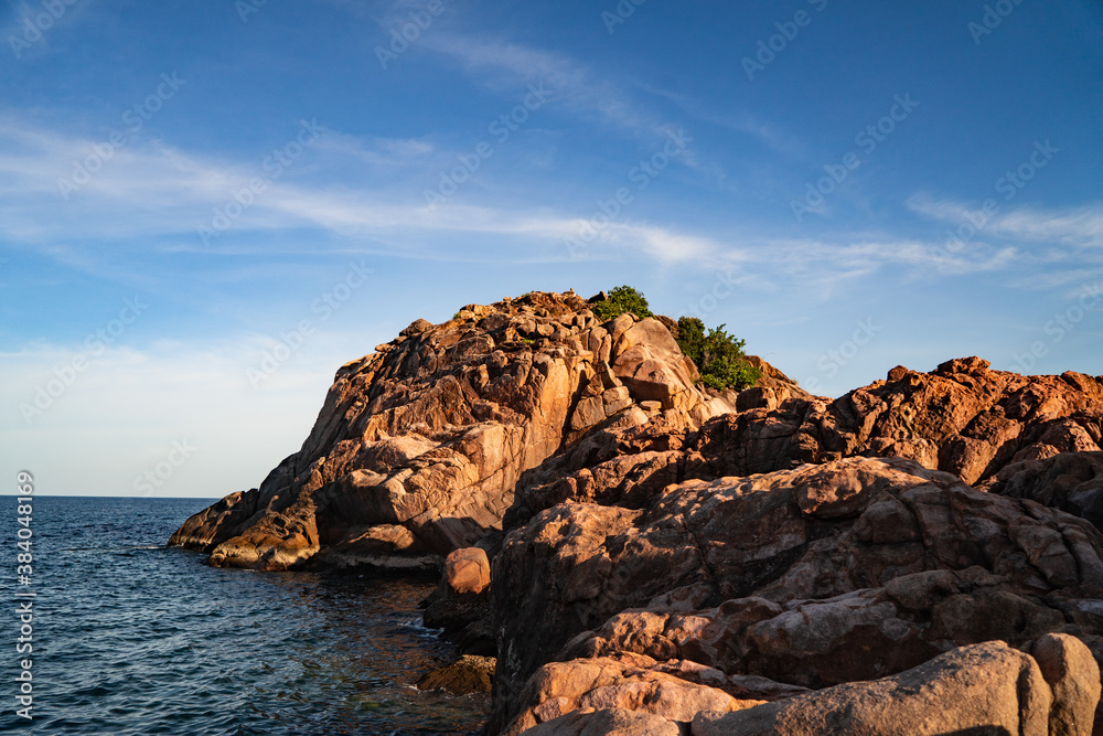 A tropical island with Cliffs and perfect bly sky at Long Beach Redang Islands, Malaysia