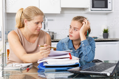 Adult woman supporting morally her daughter who upset by her studies