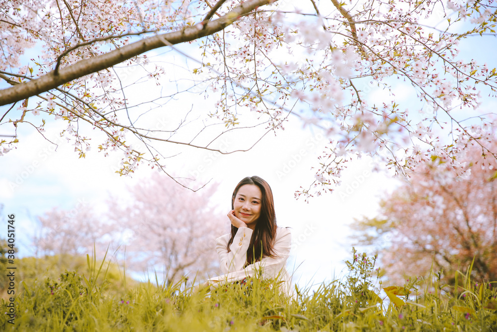 Girl and cherry blossoms in spring, Kyoto, Japan Girl and cherry blossoms in spring, Kyoto, Japan