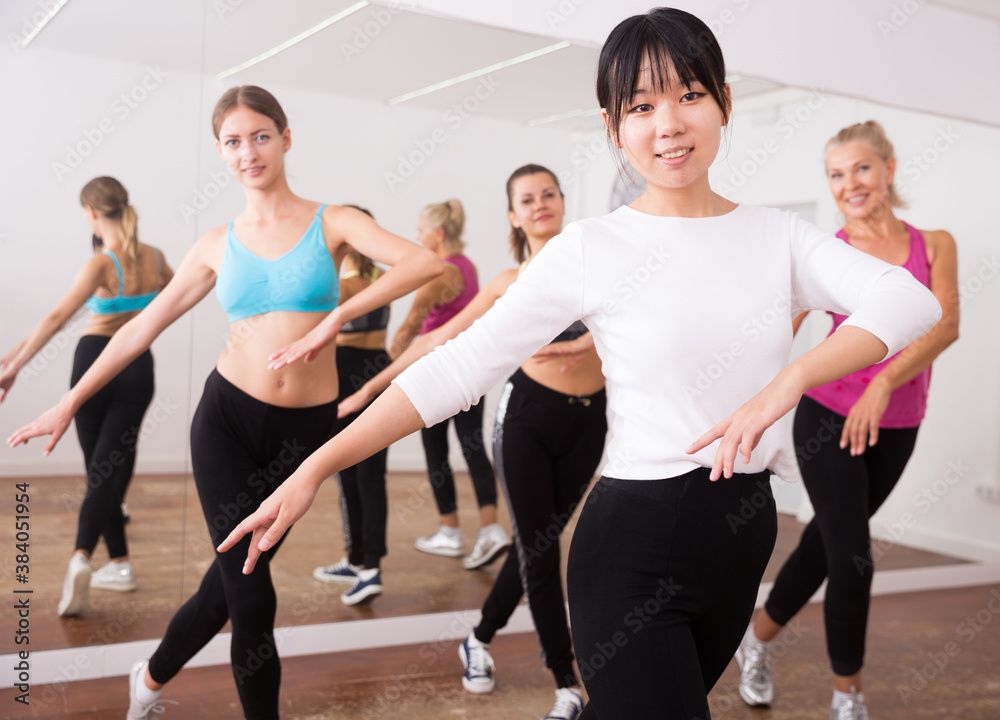 Chinese trainer leads a dance group. High quality photo