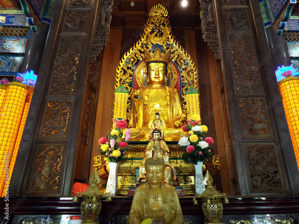 Penang, Malaysia, November 20, 2017: One of the altars of deities and images of Buddha inside the Kek Lok Si temple. Penang, Malaysia