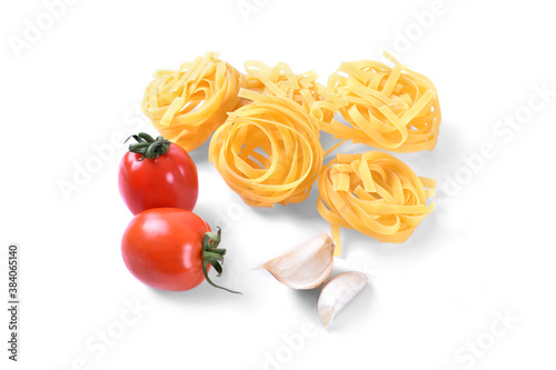 Spaghetty with garlic and red cherry tomatoes on white background