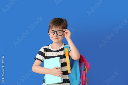 Little schoolboy on color background © Pixel-Shot