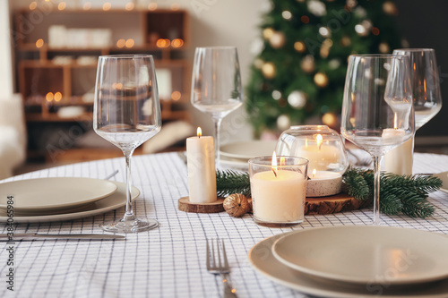 Beautiful table setting with Christmas decorations in living room