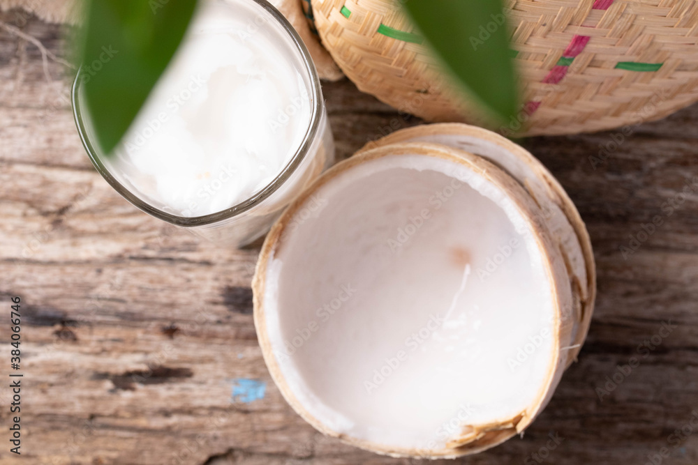 Coconut water in a glass and young coconut Coconut water in a glass and young coconut