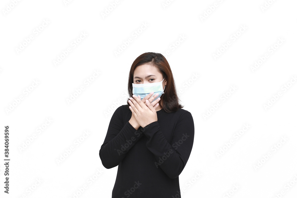 Young Asian woman wearing mask for protection from disease with isolated white background. Coronavirus concept. Indonesian woman wearing black shirt. Young Asian woman wearing mask for protection from disease with isolated white background. Coronavirus concept. Indonesian woman wearing black shirt.