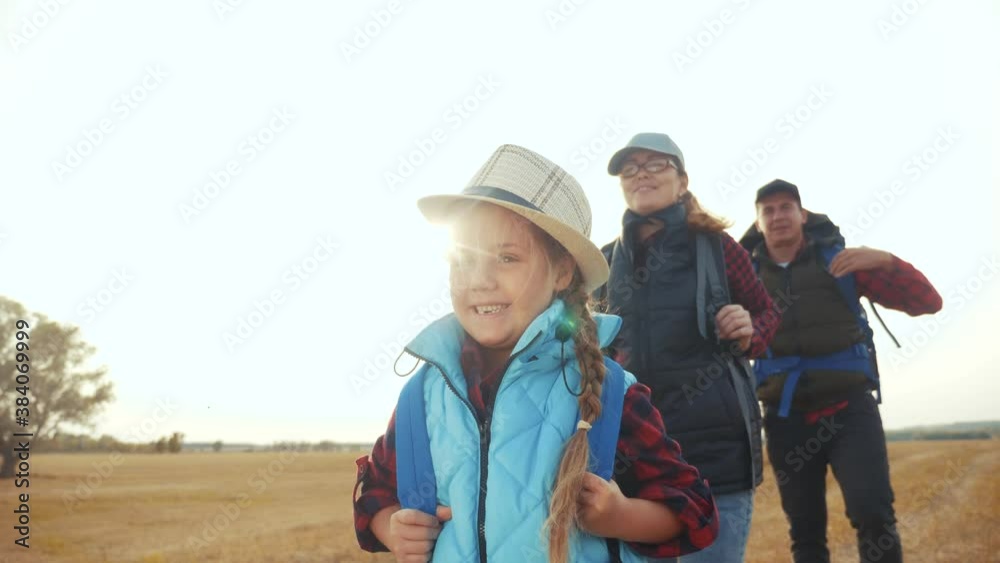 happy family tourists go hiking in the park. teamwork. adventure travel activities concept. happy family tourists with backpacks hikers go camping. group of people in park walking teamwork outdoor happy family tourists go hiking in the park. teamwork. adventure travel activities concept. happy family tourists with backpacks hikers go camping. group of people in park walking teamwork outdoor